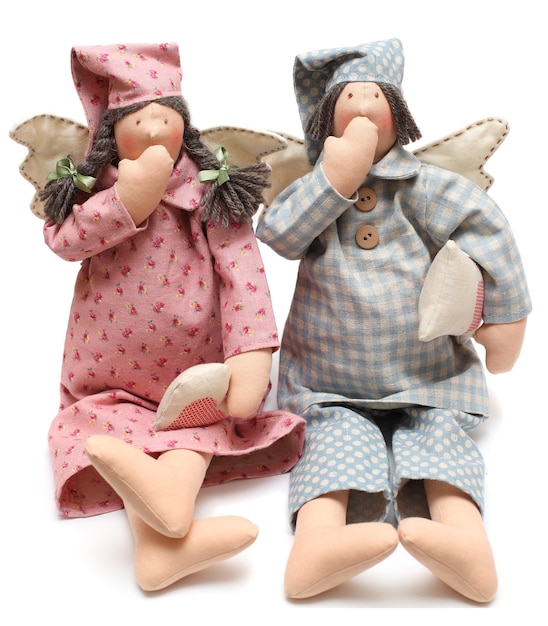 Photo bedtime concept - handmade dolls yawn