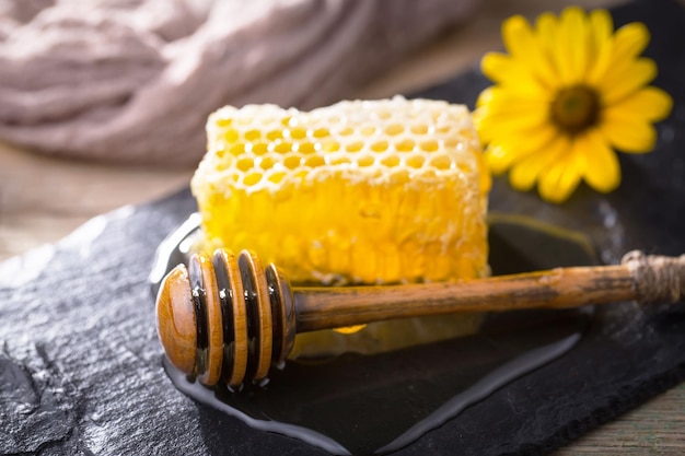 Bee honey in a composition with flowers