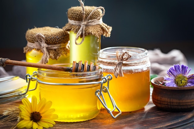 Bee honey in a composition with flowers