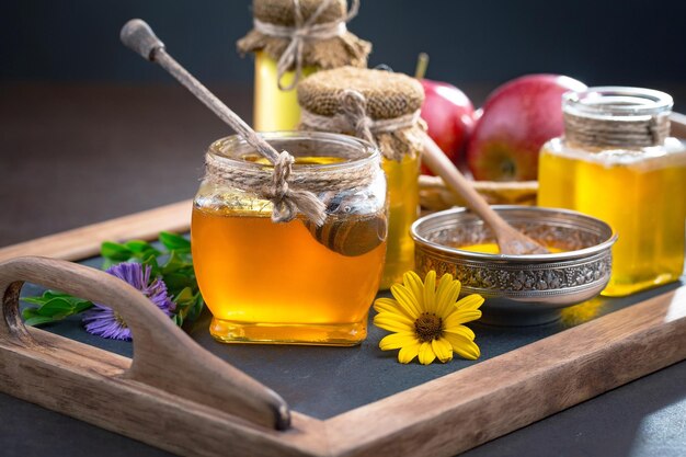 Bee honey in a composition with flowers