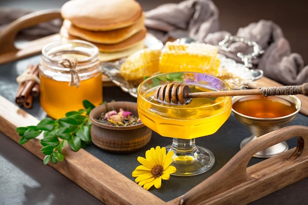 Bee honey in a composition with flowers