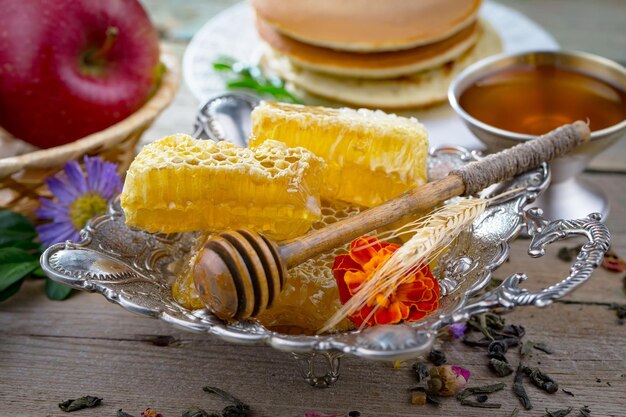 Bee honey in a composition with flowers