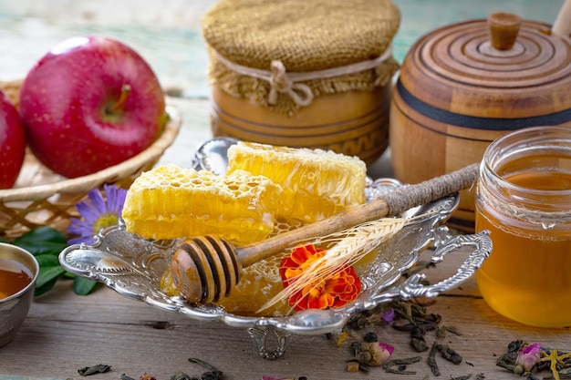 Bee honey in a composition with flowers