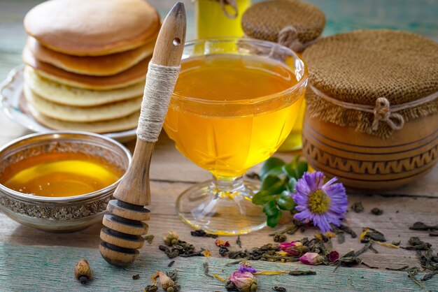 Bee honey in a composition with flowers