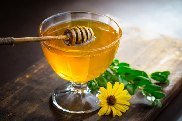 Bee honey in a composition with flowers