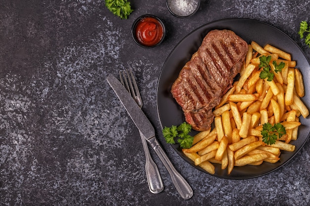 Beef barbecue steak with french fries