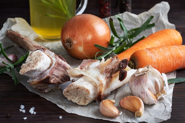 Beef bone and vegetable ingredients for cooking broth.