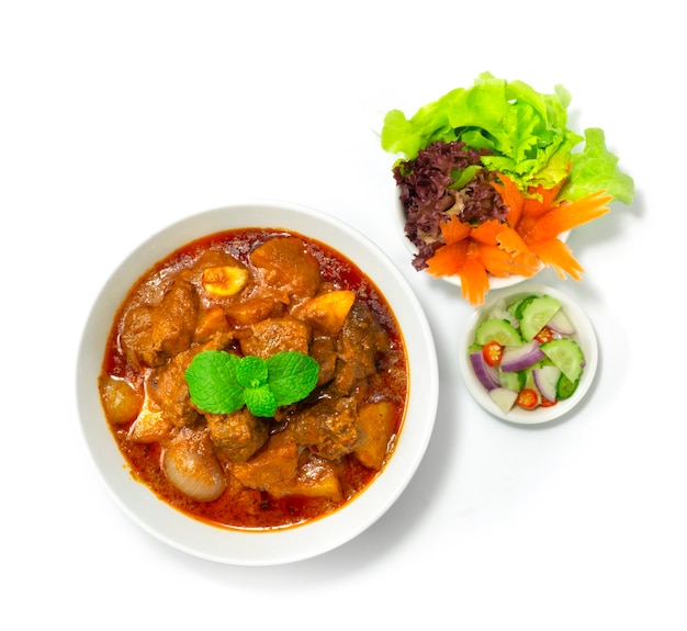 Beef Curry Massaman Asian Food Style served  Ar Jad (cucumber, onio,chili in Vinegar) decorate Vegetable topview