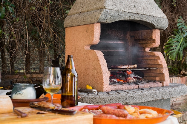 Photo beef fillet being cooked over coals in barbecue