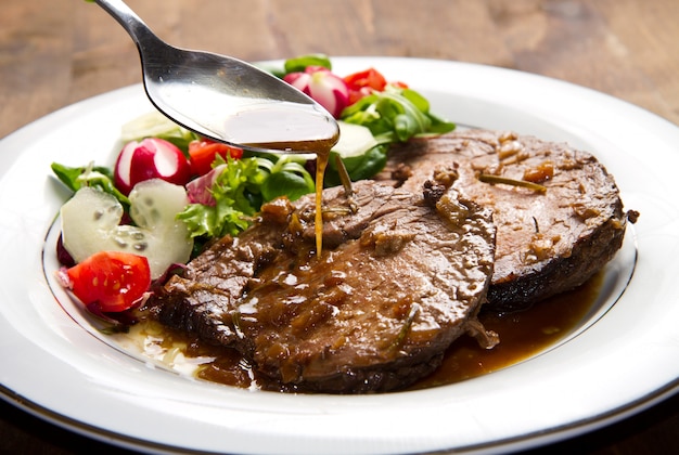  beef  garnished with fresh salad  