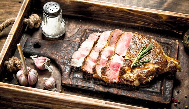 Beef grill with spices on a cutting Board.