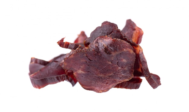 Beef jerky isolated on white. Pieces of dry meat. Close-up. Clipping path.