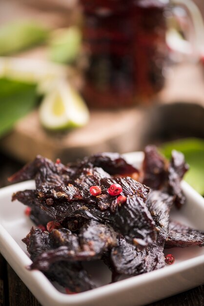 Beef Jerky on wooden background