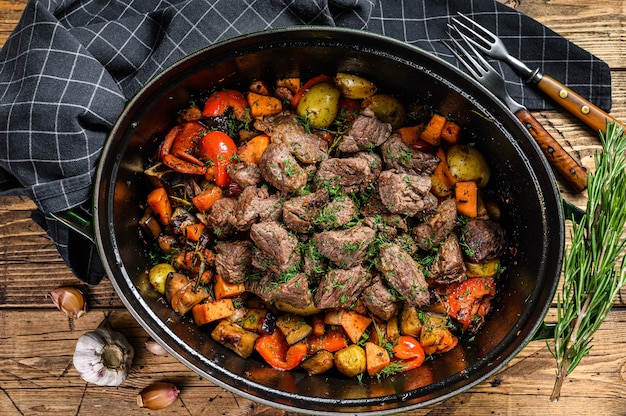 Beef meat stew with potatoes, carrots and herbs