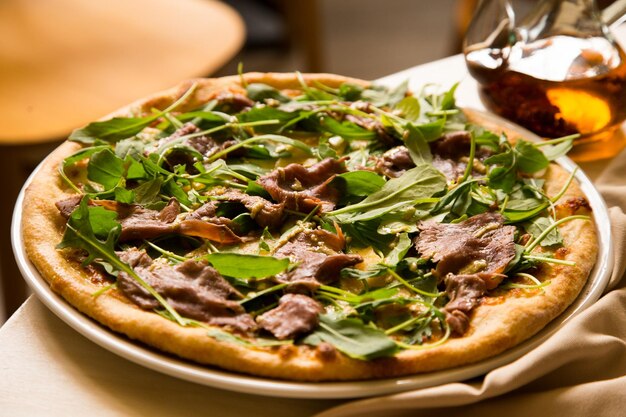 Beef pizza. Neapolitan pizza with tomato sauce and meat. Authentic Italian recipe.