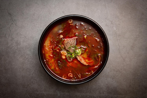 Beef and rice soup on the table.