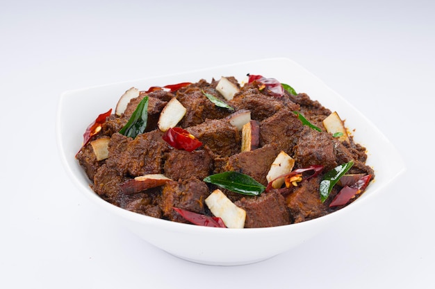 Beef roast masala or curry homemade recipe arranged in white bowl  with white background