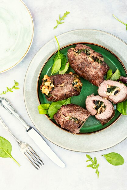 Beef rolls with mushrooms and greens