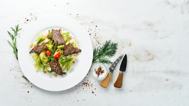 Beef salad with beans and fresh vegetables Top view Free space for your text