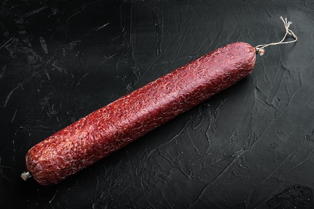 Beef Salami Sausage set, on black dark stone table