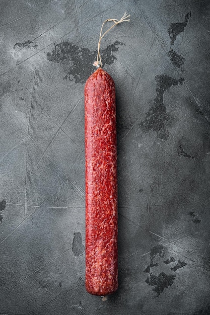 Beef Salami Sausage set, on gray stone table background, top view flat lay, with copy space for text