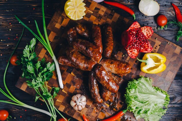 Beef sausages and grilled tomatoes