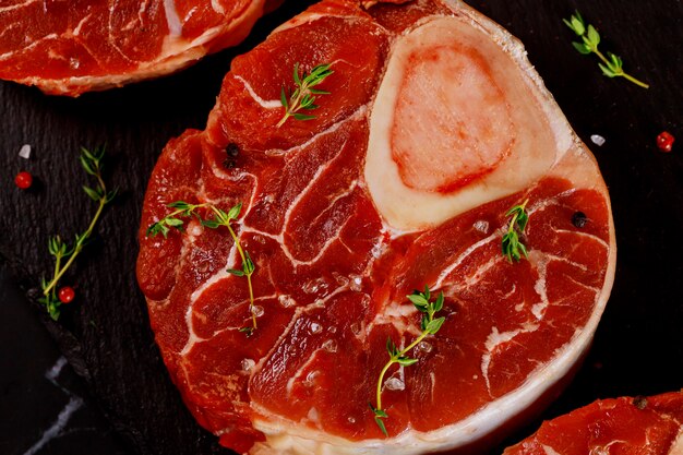 Beef shank bone in with seasonings. Close up.