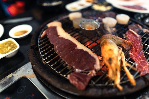 Beef and shrimp on the grill at the restaurant