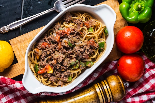 Beef spaghetti, There are plenty of tomatoes and chopped beef on it.