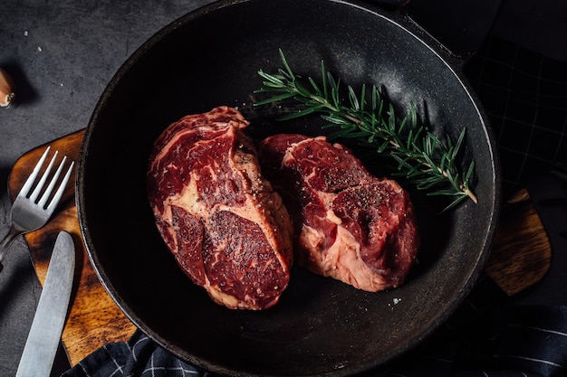 beef steak on black table background