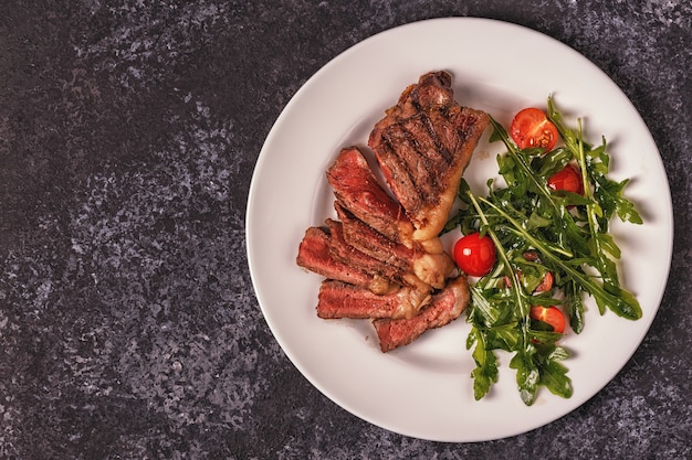 Beef steak on a dark background