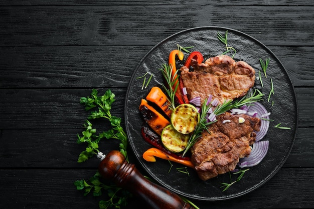 Beef steak Juicy veal steak with rosemary and spices Top view Barbecue