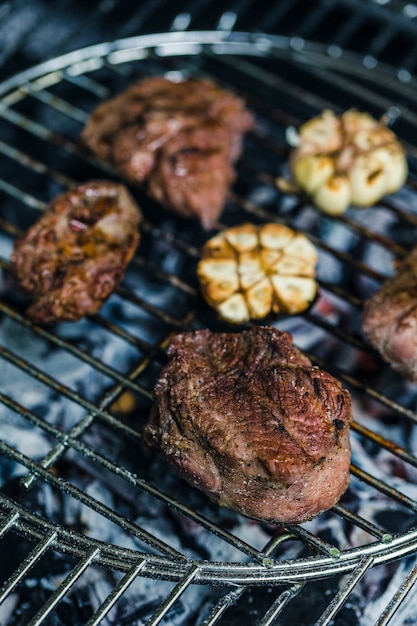 Beef steak with garlic prepared on barbecue