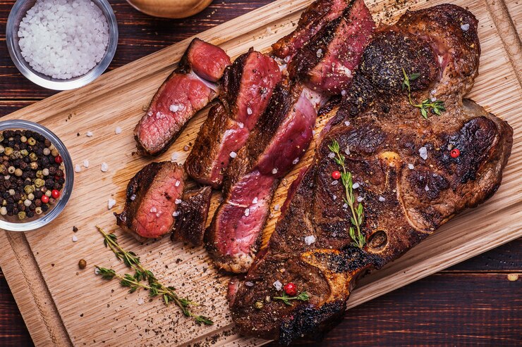 Beef steak on a wooden background