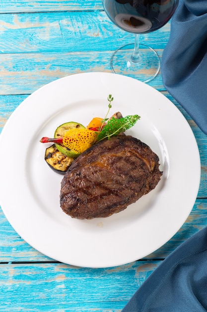 Beef steak on a wooden board