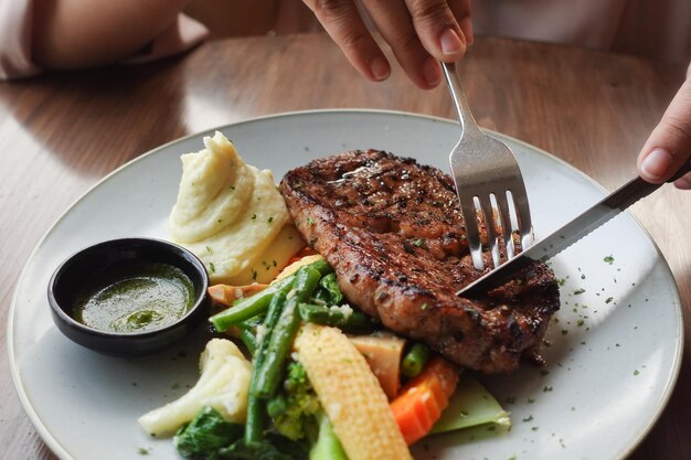 Beef steaks meat with vegetables on a plate