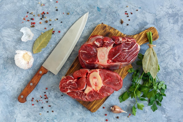 Beef steaks Osso Buco on cutting board