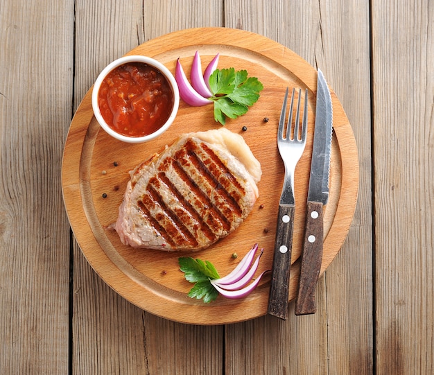 Beef steaks with tomato sauce