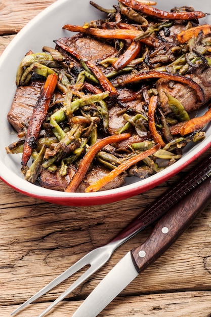 Beef steaks with vegetables