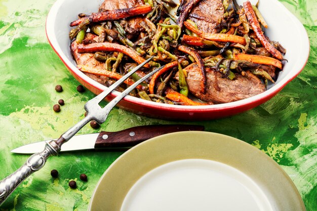 Beef steaks with vegetables