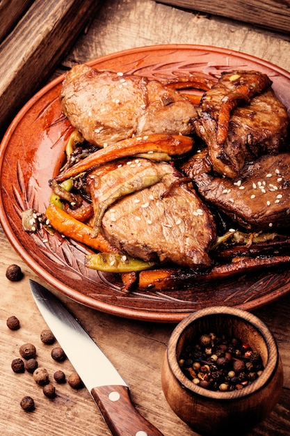 Beef steaks with vegetables