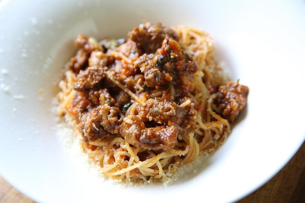 Beef stew spaghetti on wood background