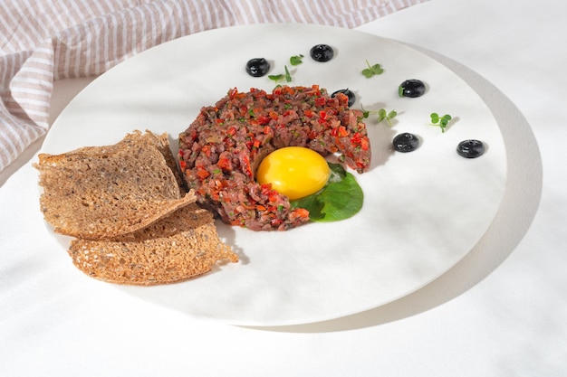Beef tartar with capers and small toasts