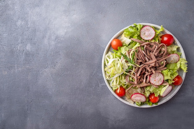 Beef tongue salad with fresh vegetables