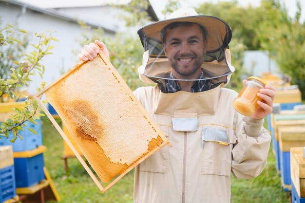 Beekeeper working collect honey Beekeeping concept