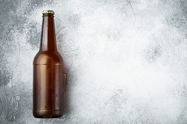 Beer bottle on gray stone 