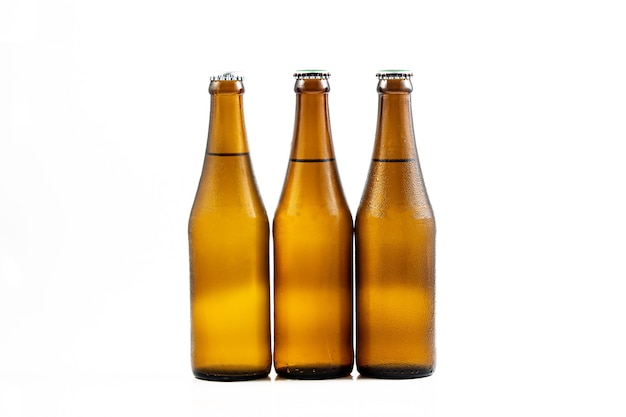 beer bottle on a white backgroundGlass bottles of different beer on light grey background