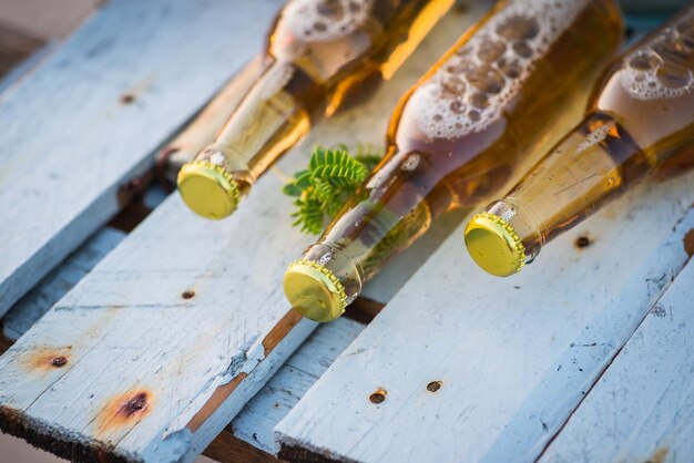 Beer bottles laying on the wooden board