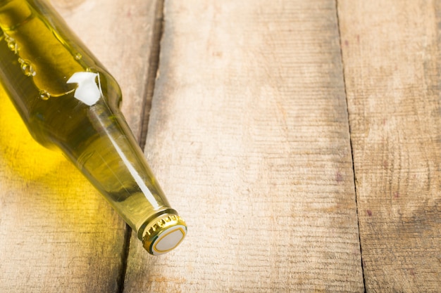 Beer bottles on a wooden table background