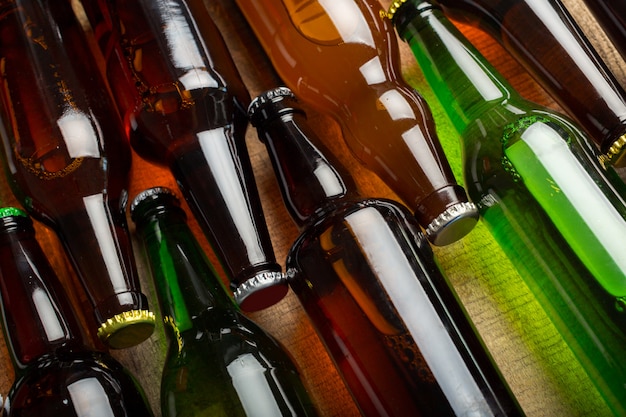 Beer bottles on a wooden table .